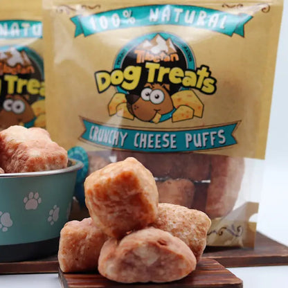 Dog treats in a bowl with packaging labeled 'Dog Treats Co.' on a white background