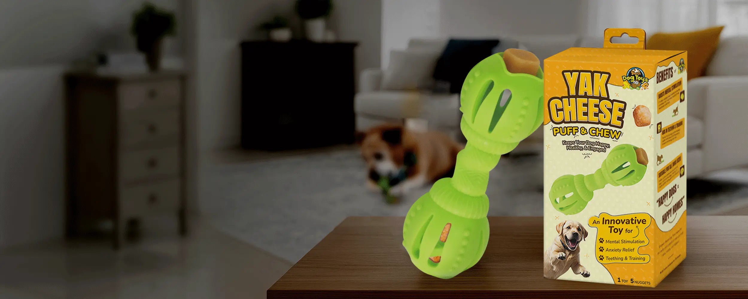 Green dog toy with 'Yak & Cheese' packaging on a table in a living room setting.